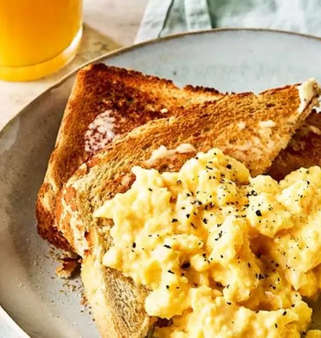 Classic Scrambled Eggs: The Easiest 5-Minute American Breakfast 2 Classic scrambled eggs garnished with pepper and parsley