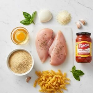 Ragu Chicken Parm Recipe – Easy Baked Chicken Parmesan with Cheesy Pasta 3 Ingredients for Ragu chicken parm recipe including chicken breasts, breadcrumbs, egg, pasta, mozzarella, Parmesan cheese, and Ragu sauce